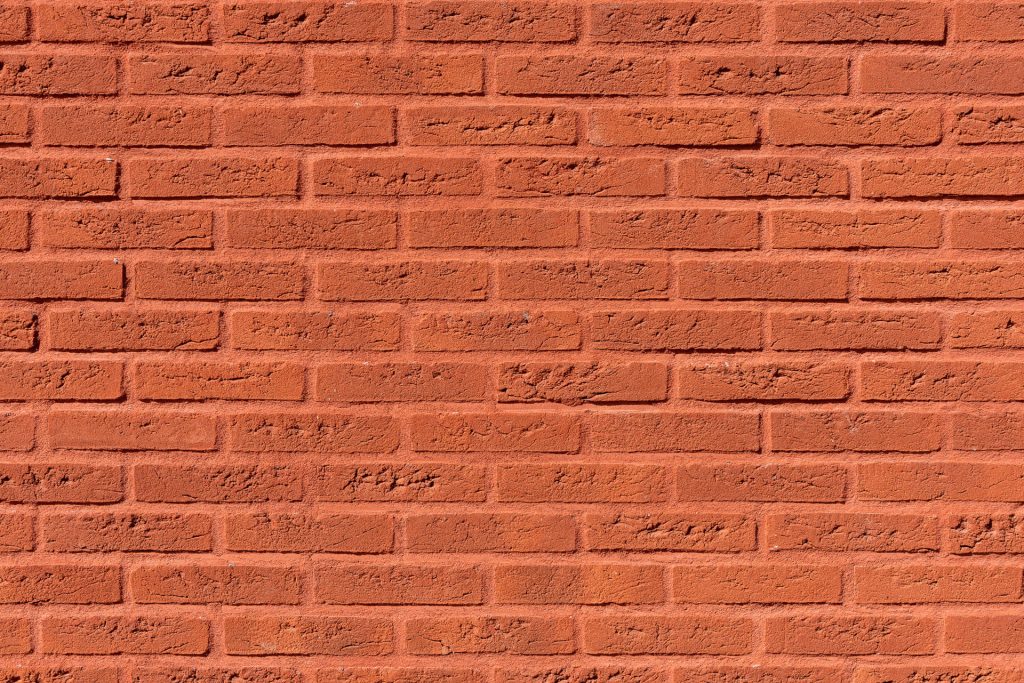Detail van rode muur met rode voeg